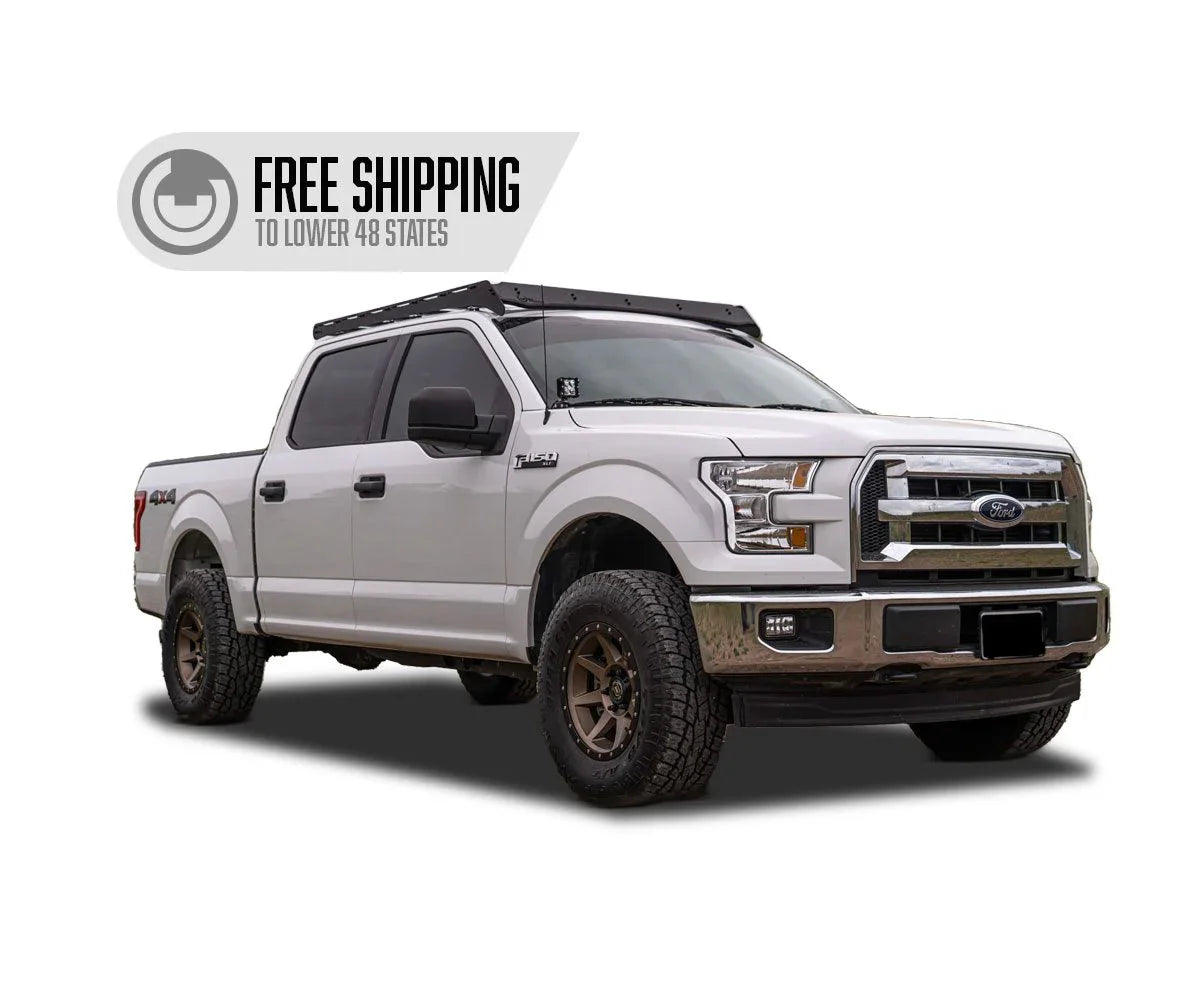 Ford F-150 pickup with roof rack and off-road tires, free shipping promotion