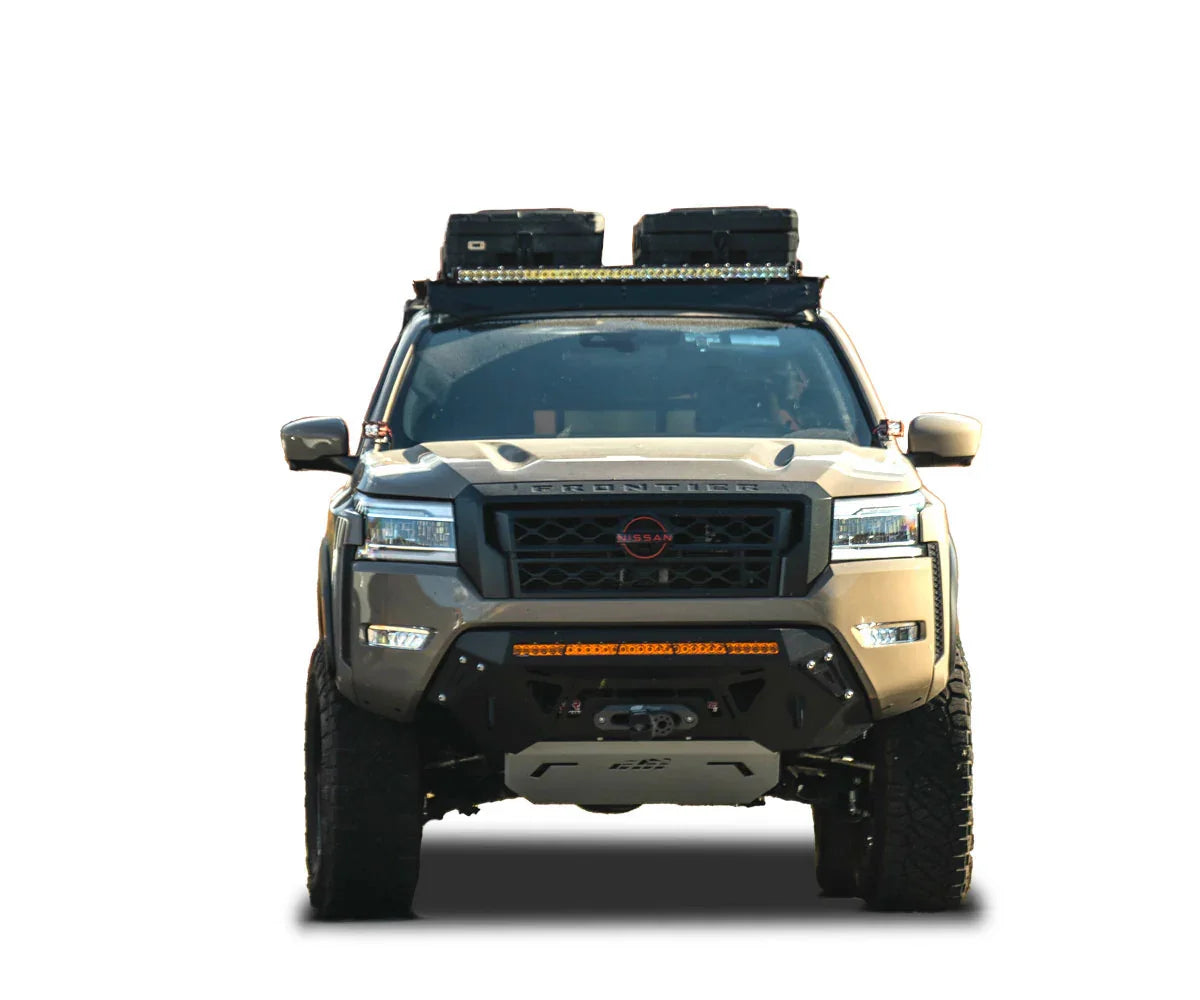 Nissan Frontier with roof rack, off-road bumper, LED light bar, and expedition gear