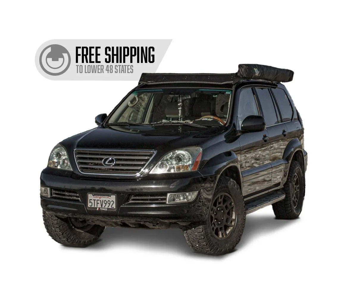 Lexus GX470 SUV with roof rack and camping gear, off-road tires, free shipping badge