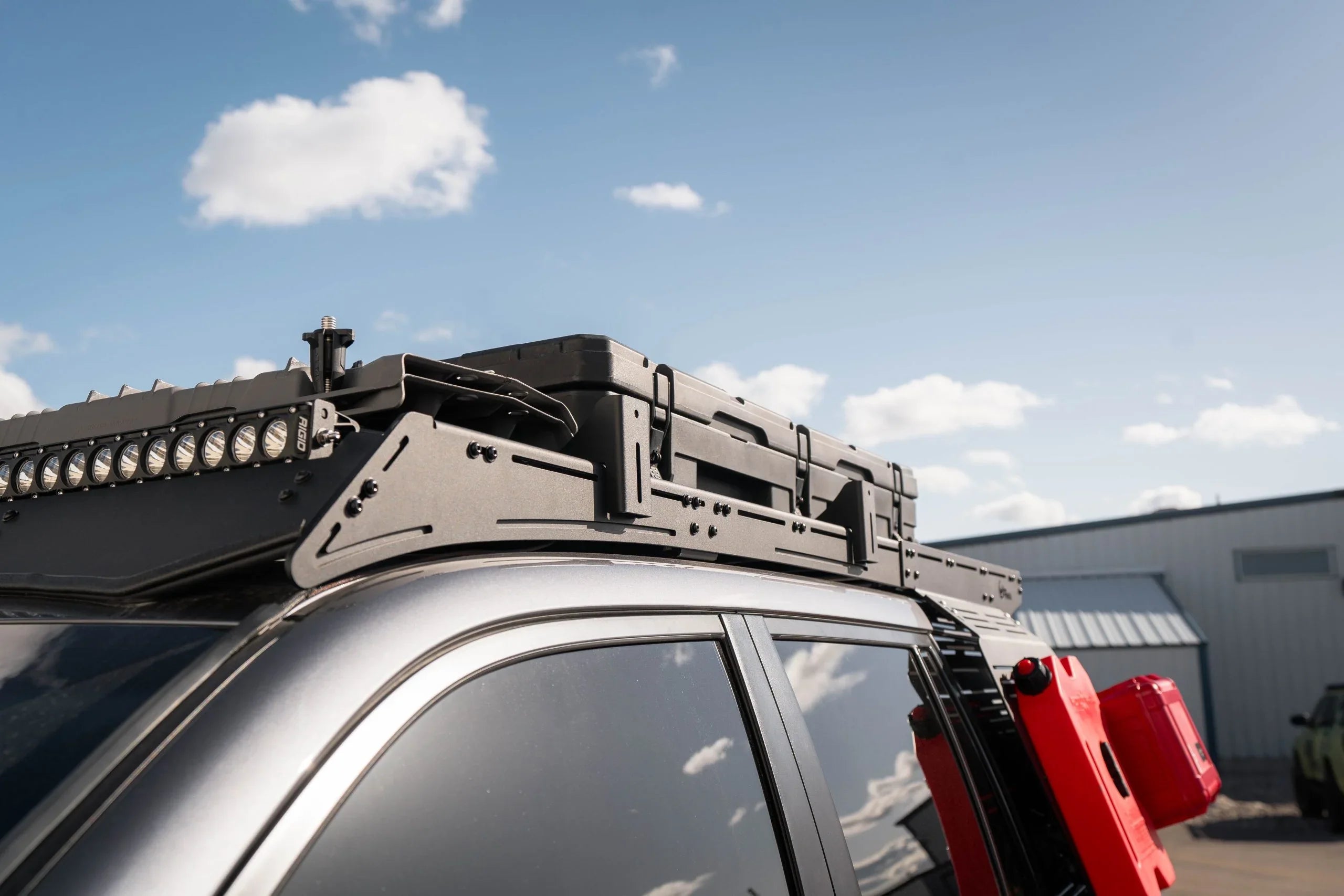 Overlanding roof rack with pro awning mounts and gear on SUV for expedition camping