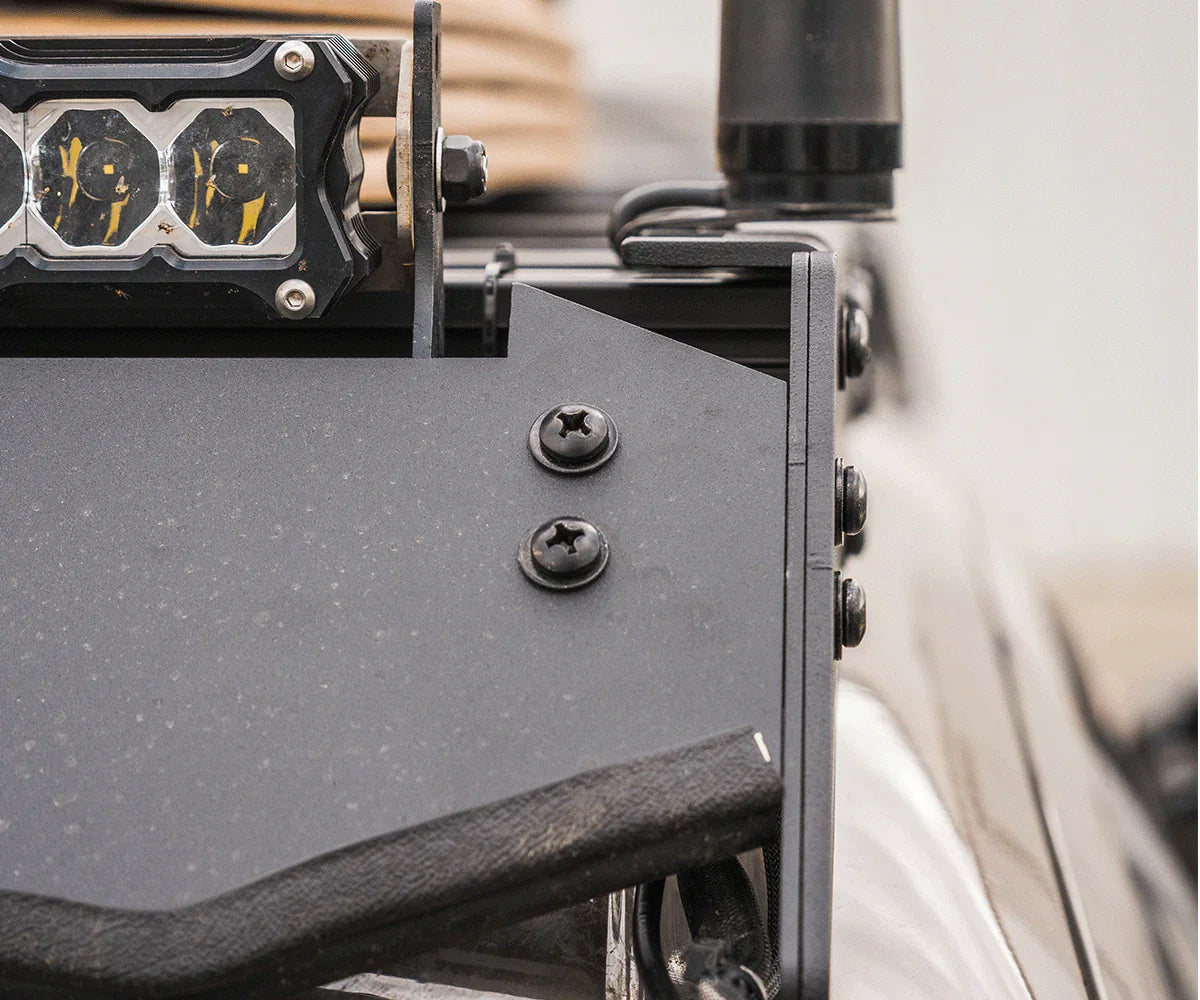 Close-up of off-road vehicle accessory mount with LED light and rugged hardware