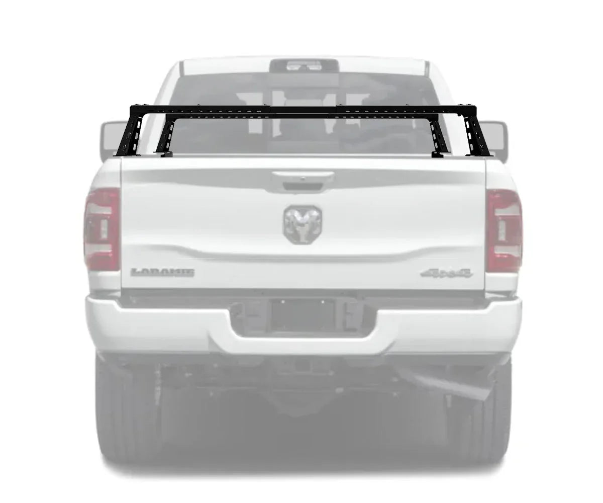 Black bed bars rack mounted on white RAM 2500 pickup truck for overlanding gear