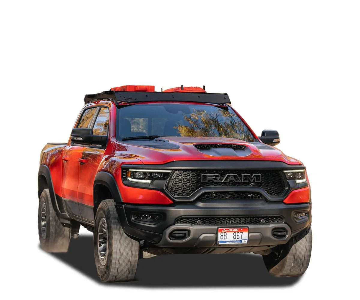 Red Ram 1500 Crew Cab with roof rack and gear, off-road overland accessories visible