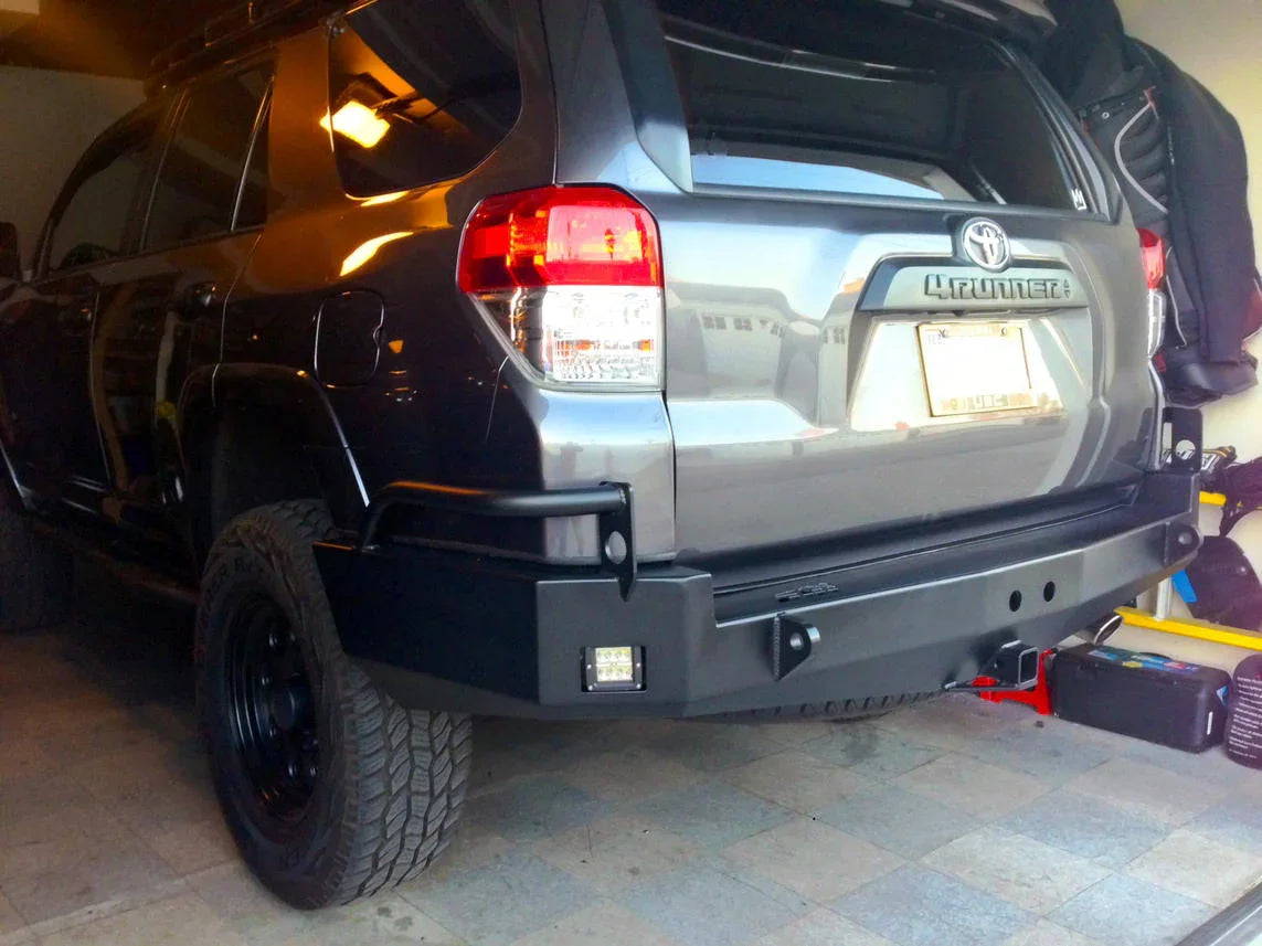 Steel rear bumper installed on Toyota 4Runner, off-road overland accessory, garage setting