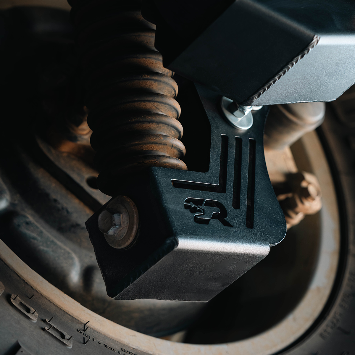 Rear shock skid plate installed on 2024 Toyota Tacoma suspension component