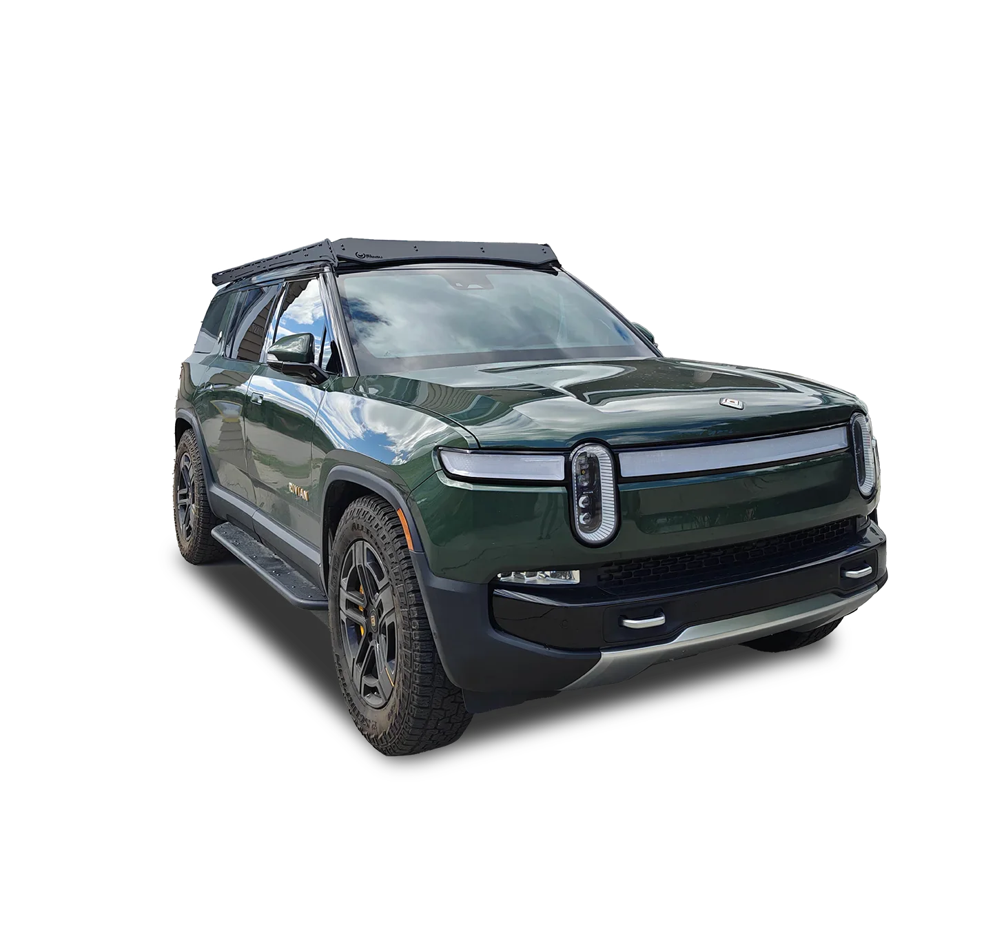 Green Rivian SUV with overlanding roof rack, rugged tires, adventure vehicle accessories