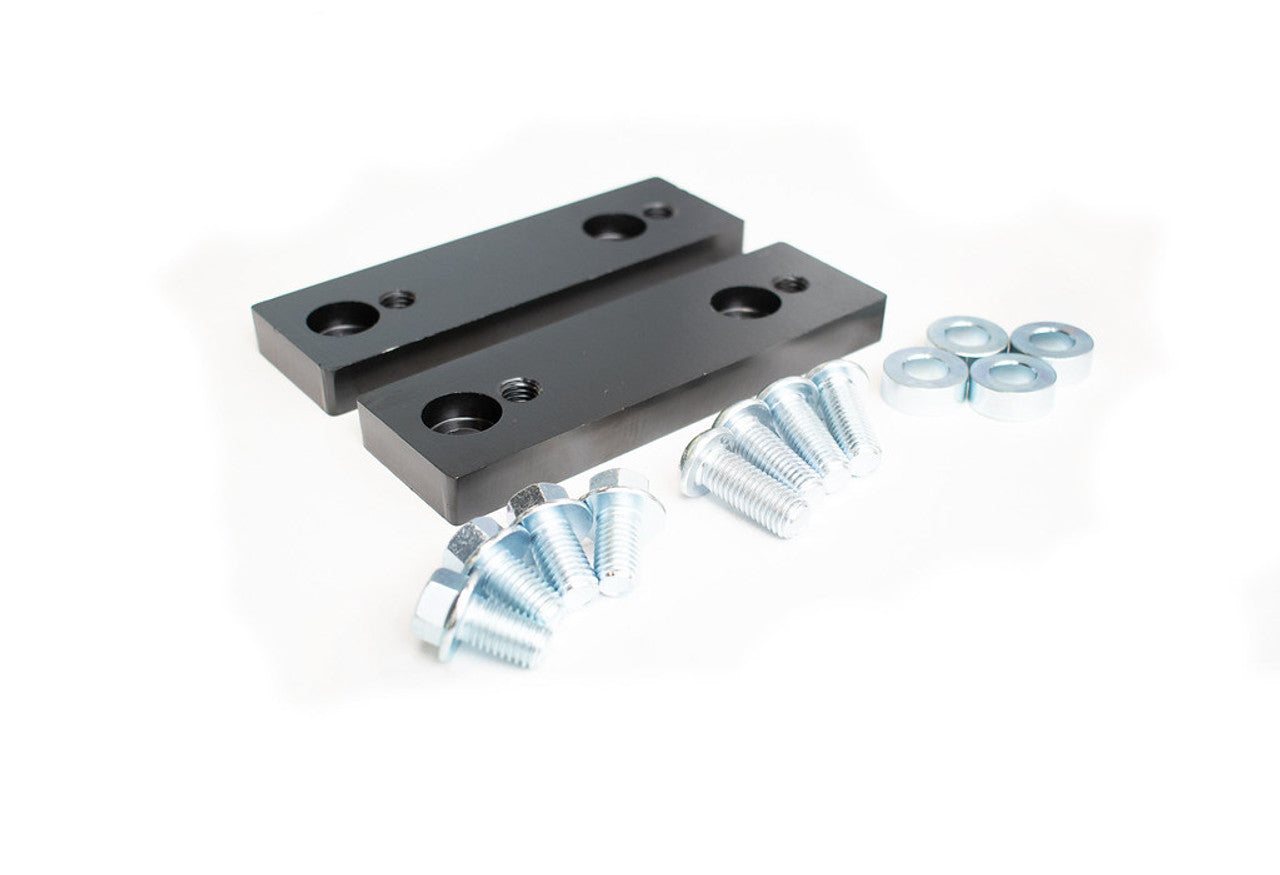 Black billet aluminum mounting brackets with bolts and washers for off-road vehicle accessories