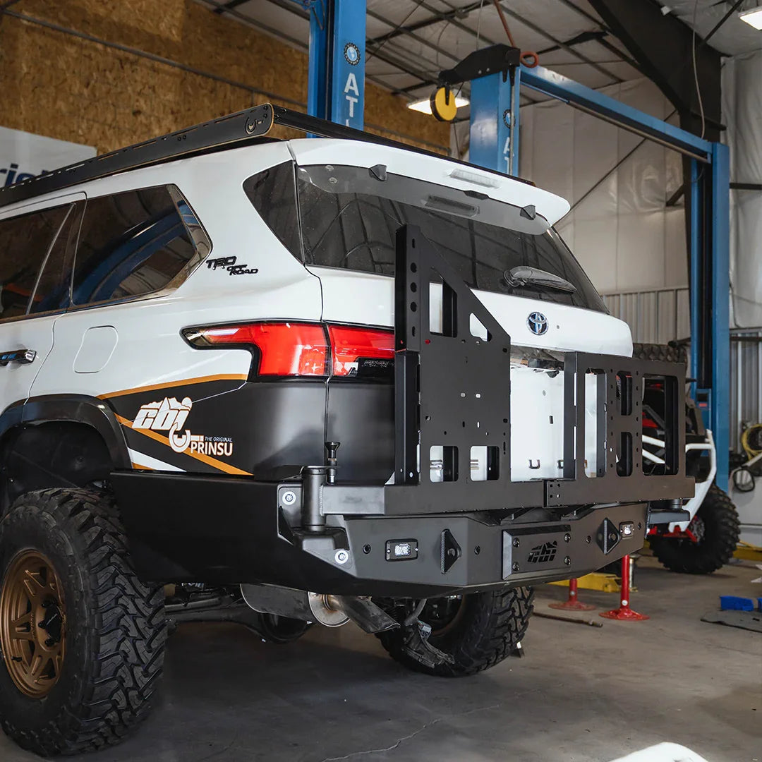 Toyota TRD Pro SUV with aftermarket bolt-on swing arms and off-road rear bumper