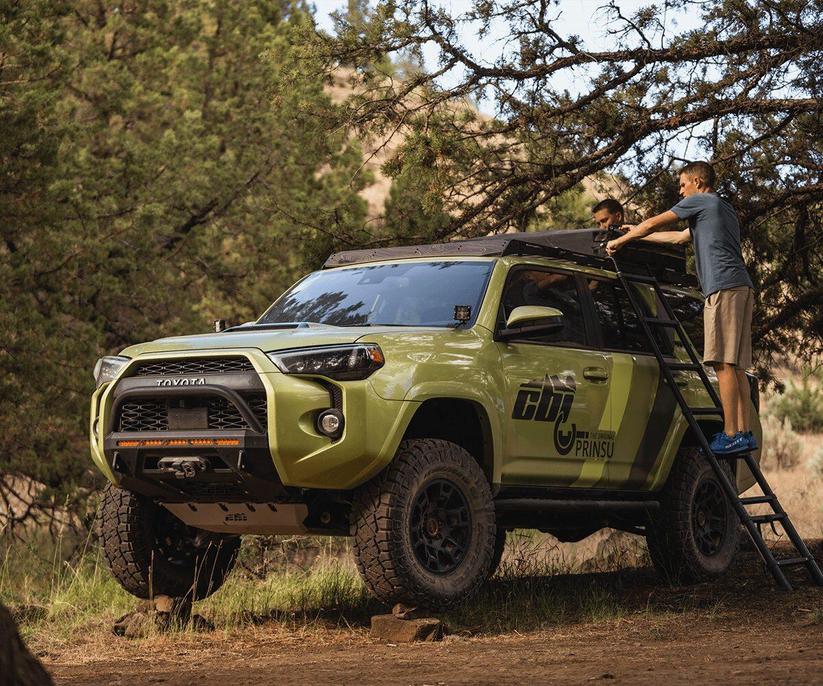 Setting up rooftop tent on Toyota 4Runner with Prinsu roof rack in forest campsite