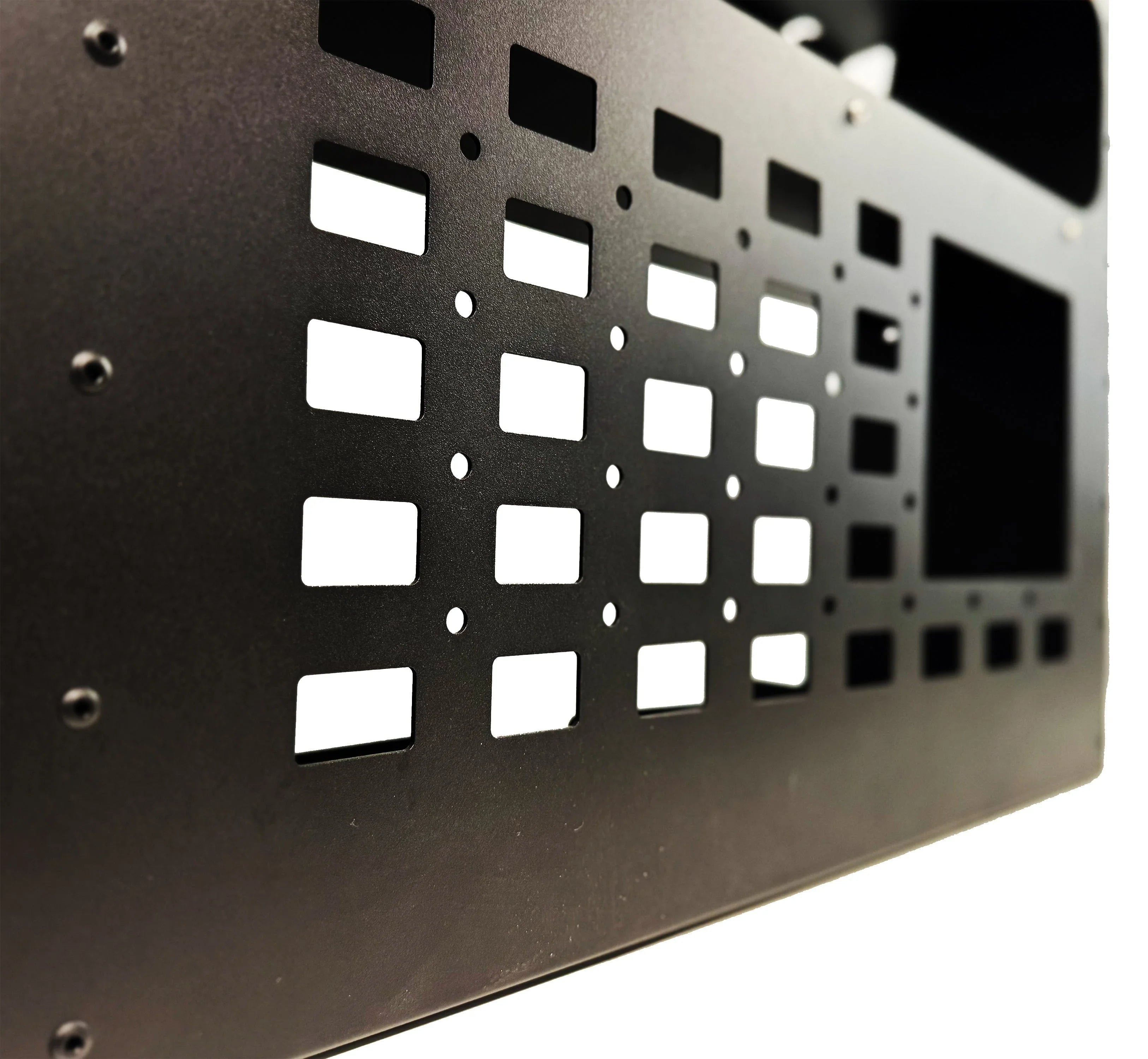 Close-up of black steel molle panel with square cutouts for vehicle storage customization