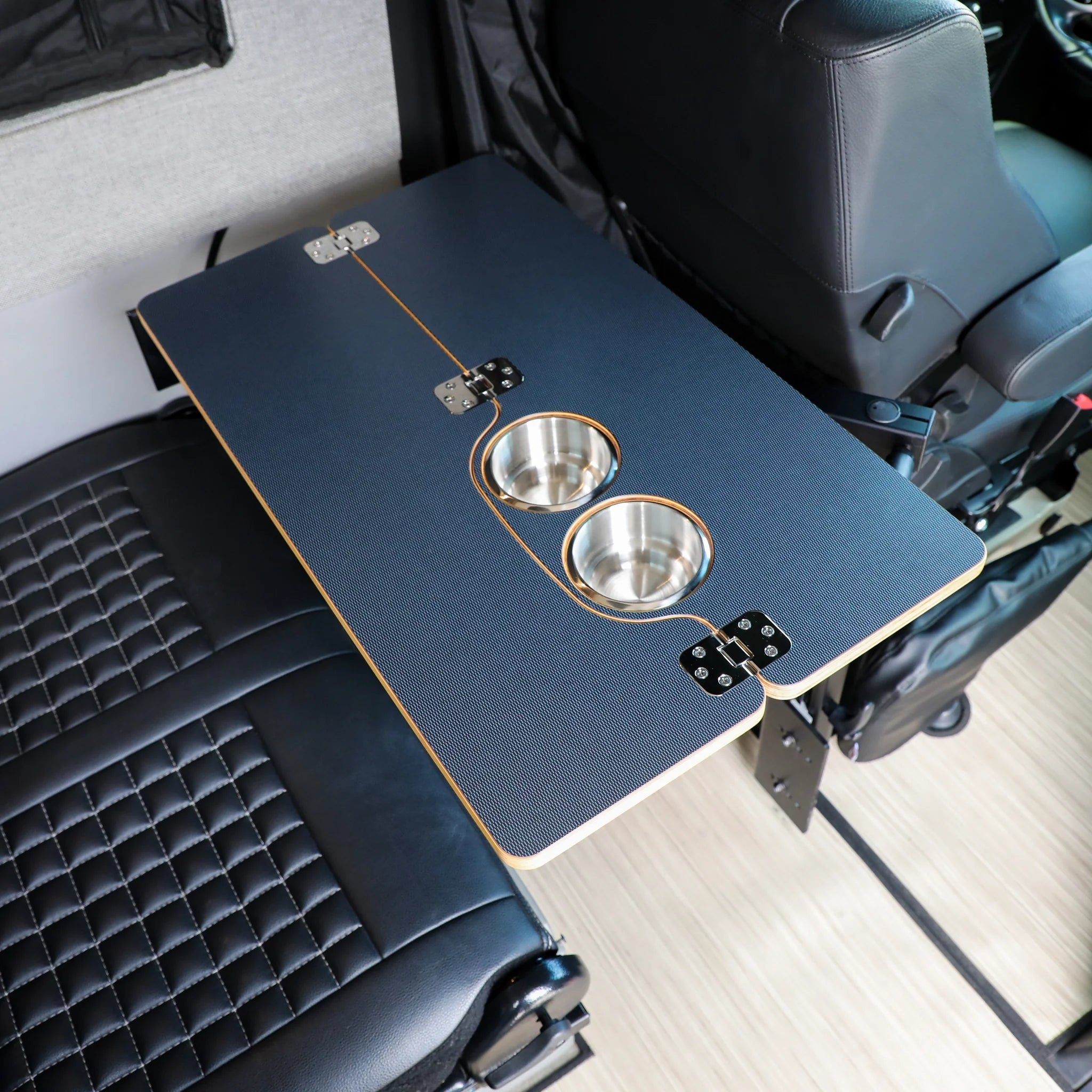Foldable overlanding vehicle table with two built-in cup holders, mounted between seats