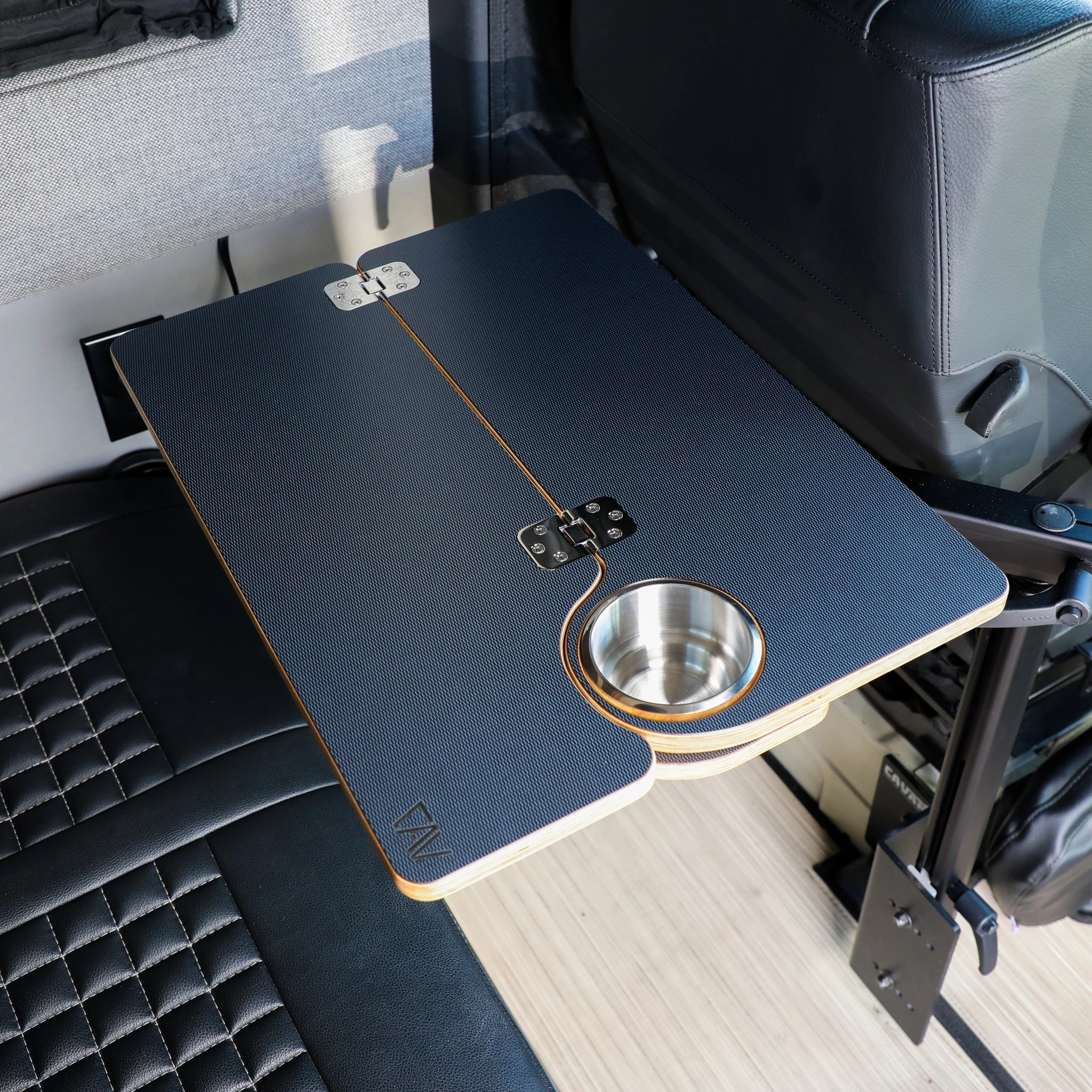 Foldable overlanding vehicle table with cup holder mounted inside camper van