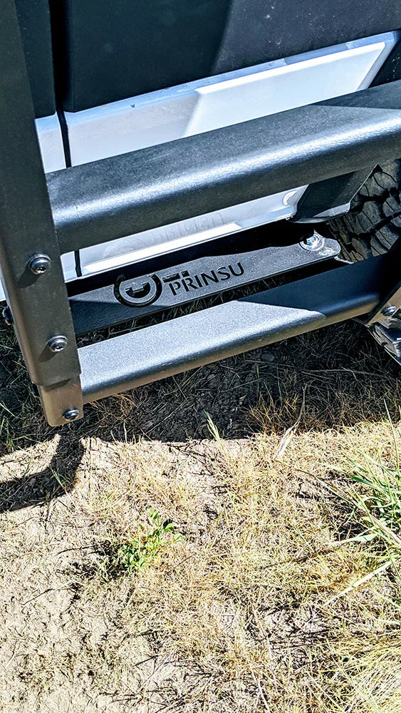 Close-up of Prinsu roof rack ladder on a van, off-road setting, outdoor adventure gear