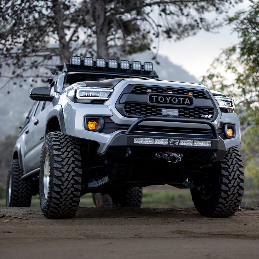 Stealth front bumper with LED lights on lifted Toyota Tacoma off-road truck
