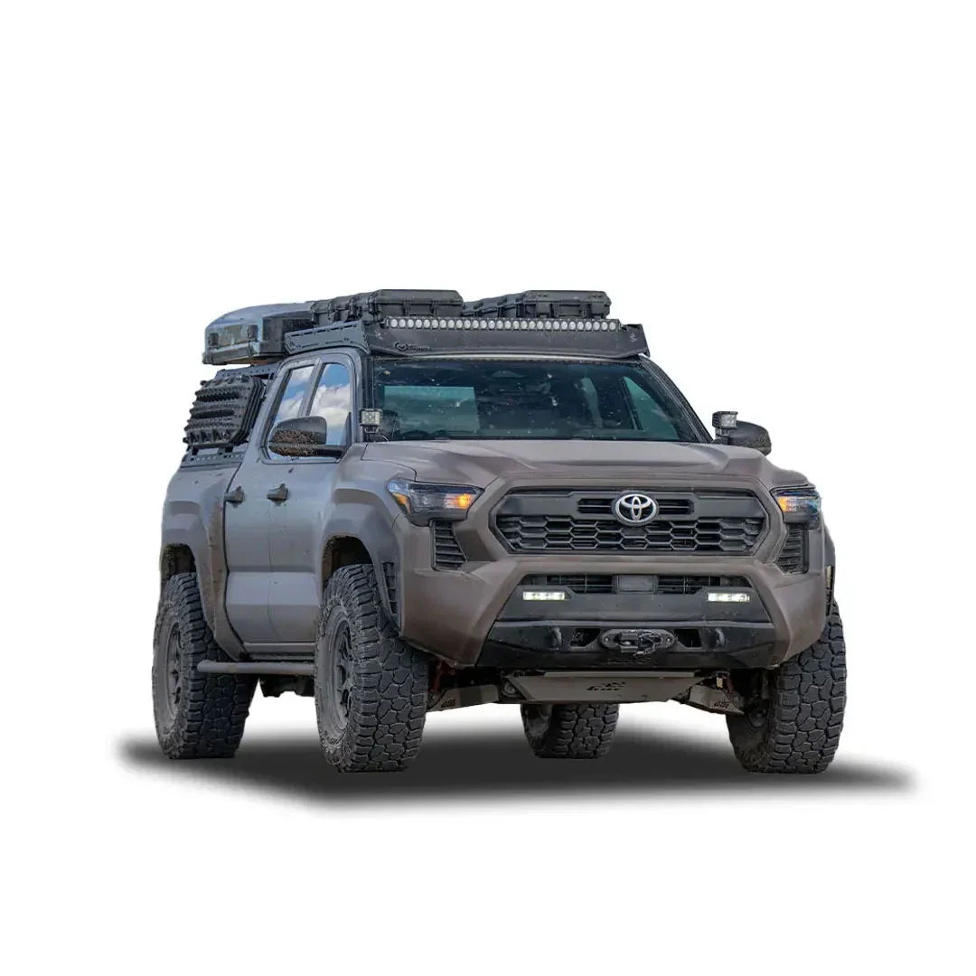 Off-road Toyota Tacoma with overlanding gear, roof rack, and rugged accessories