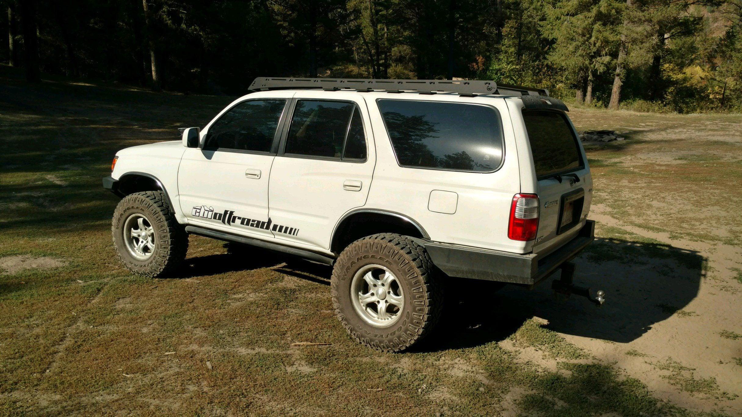 Toyota 4Runner with Prinsu roof rack and off-road tires parked outdoors