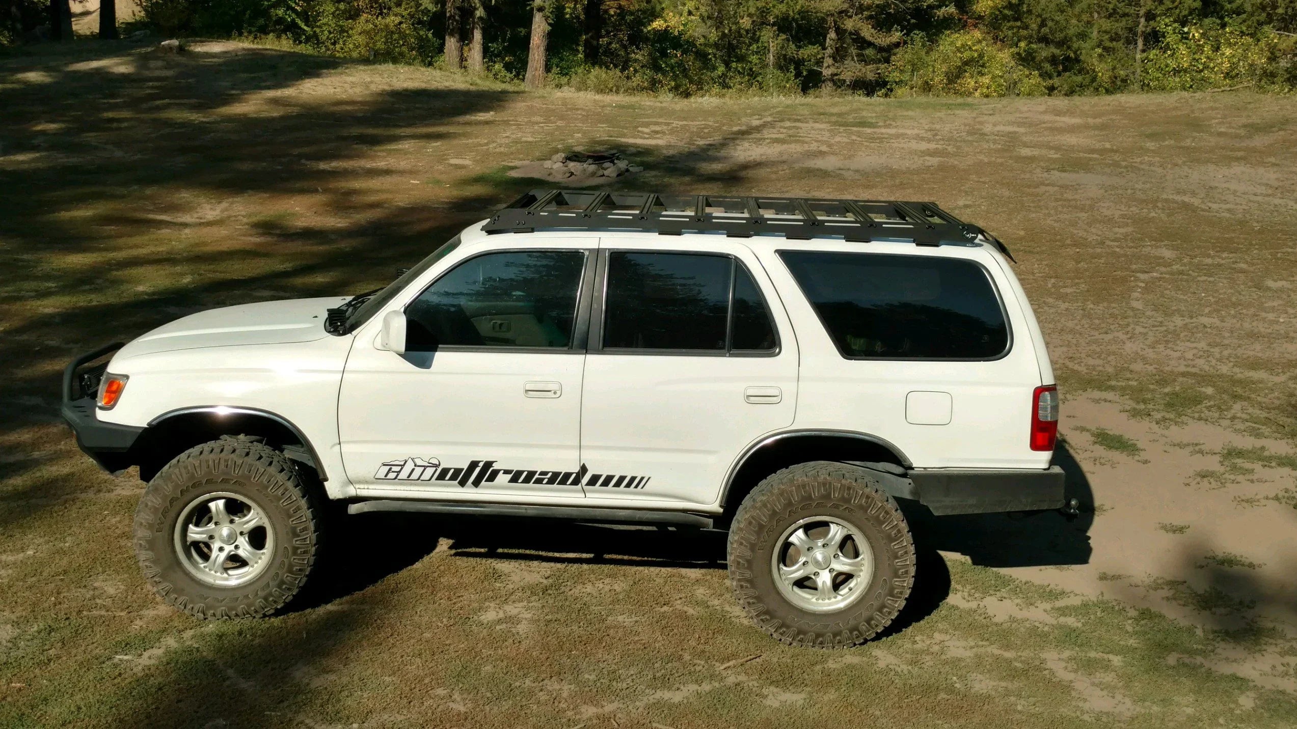 Toyota 4Runner with Prinsu roof rack and off-road tires parked outdoors