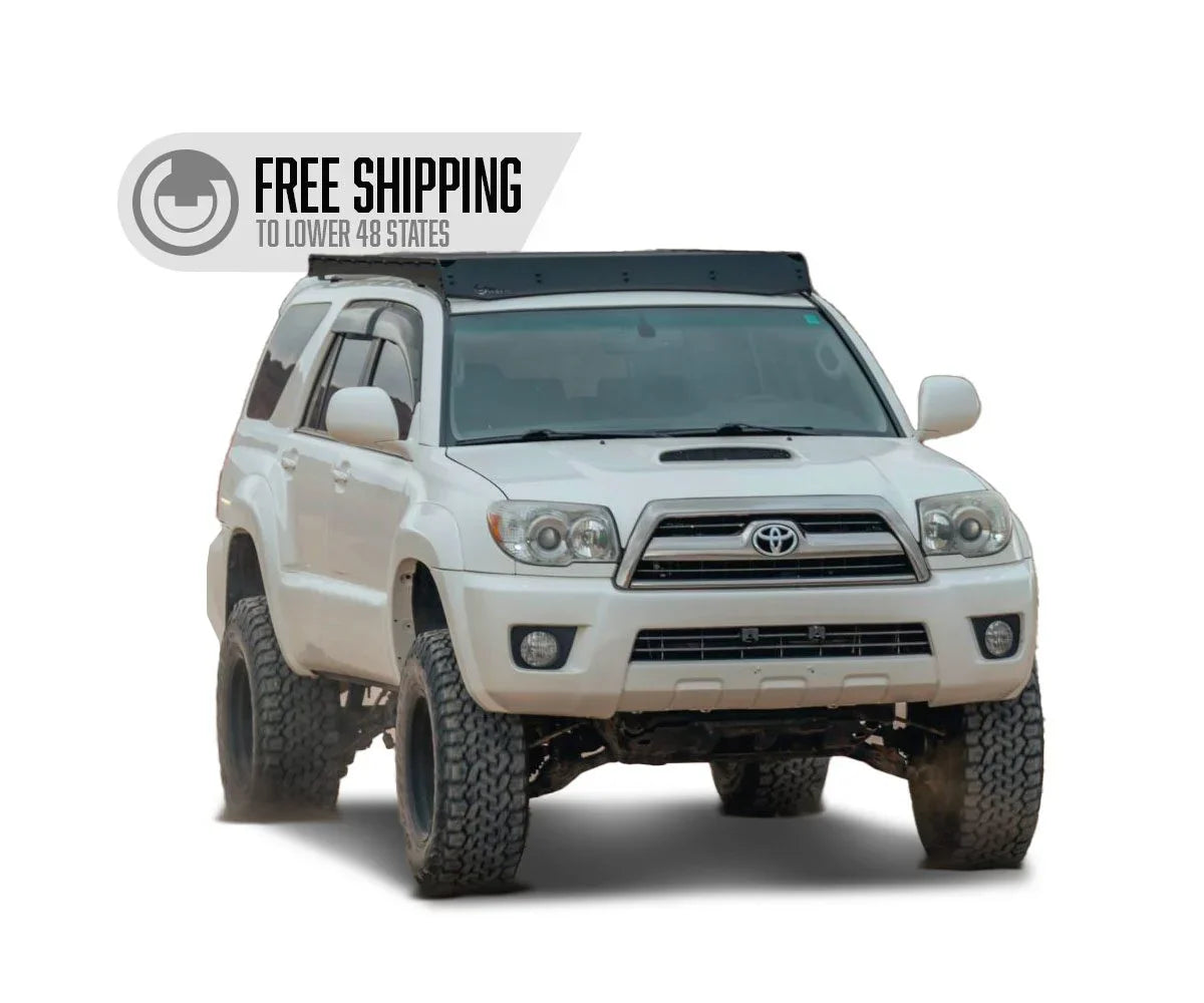 White Toyota 4Runner with off-road tires, free shipping to lower 48 states banner.