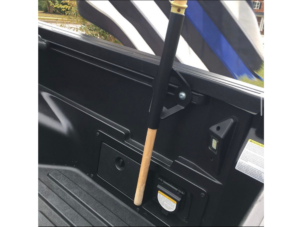 Toyota truck bed rail flag pole mount installed in truck bed with flagpole