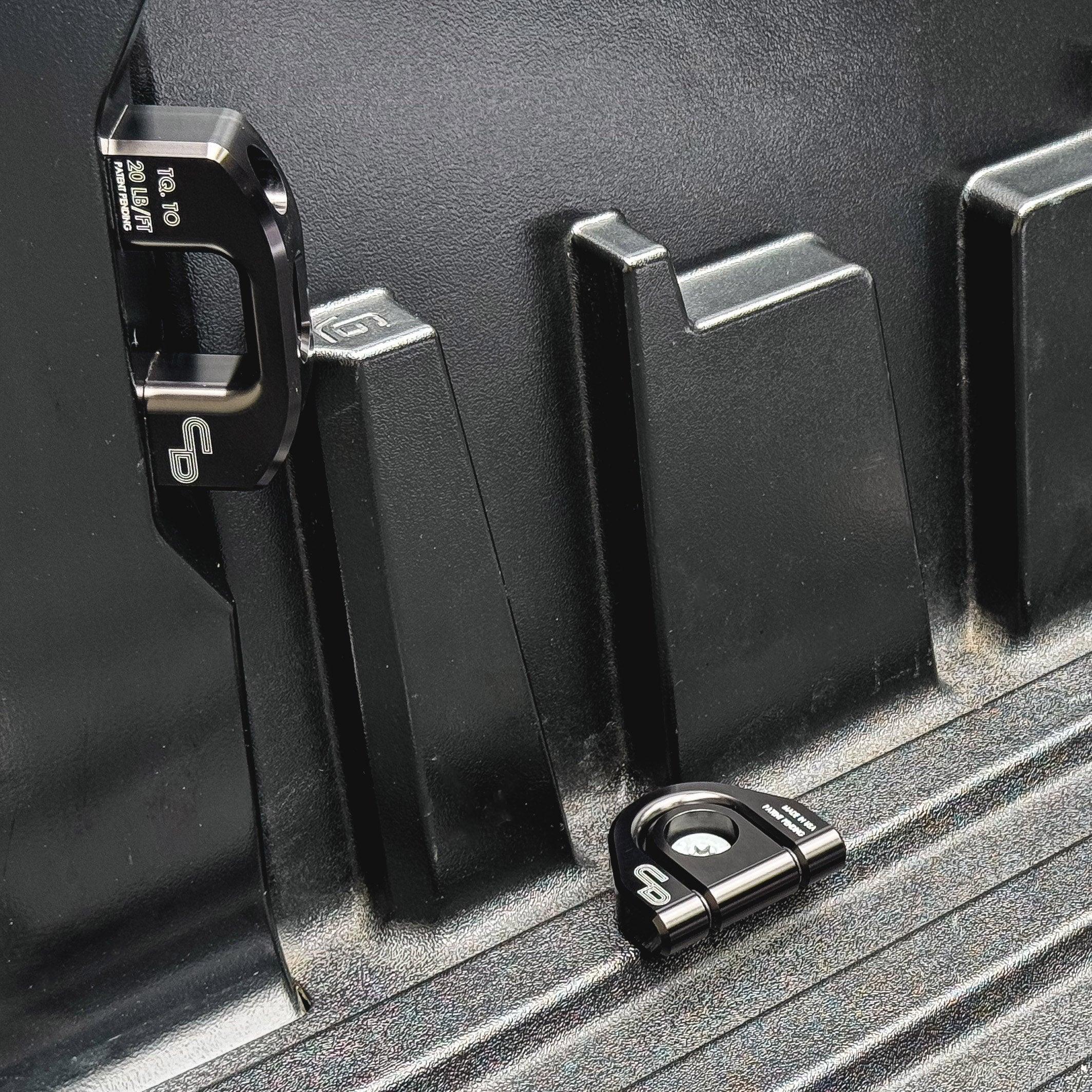 Black anodized ring bed tie down installed in Toyota Tundra truck bed