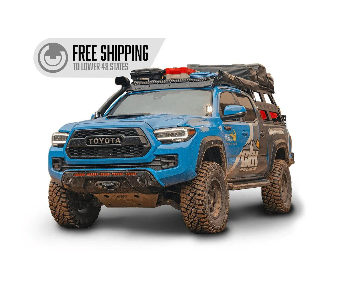 Lifted blue Toyota Tacoma overland truck with camping gear, free shipping to lower 48 states badge.