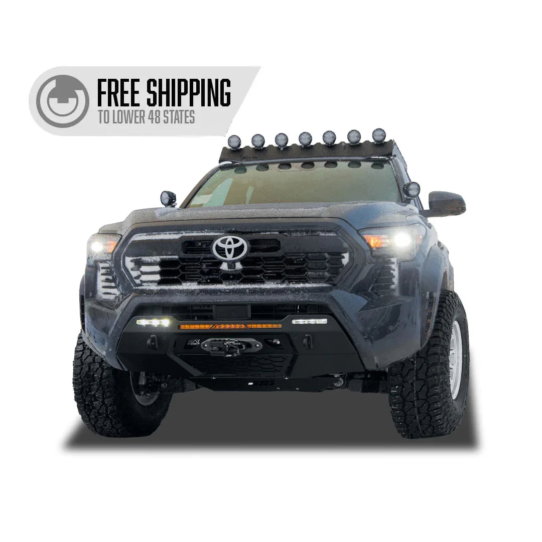Front view of a Toyota Tacoma with off-road accessories and roof lights