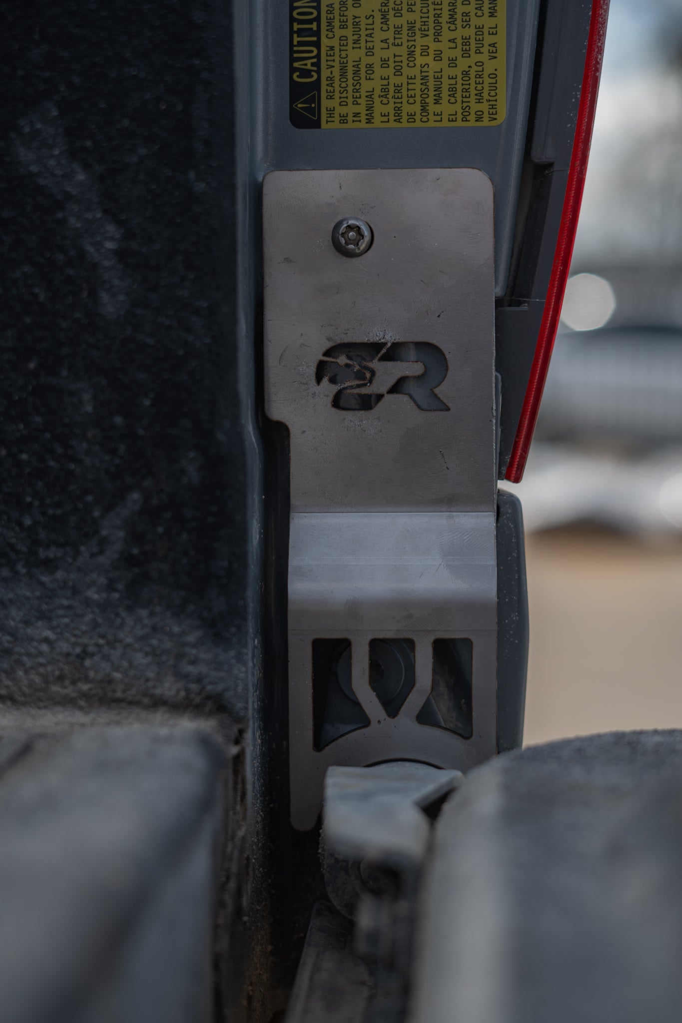 Tailgate lock protector installed on 2014-2021 Toyota Tundra truck, close-up view
