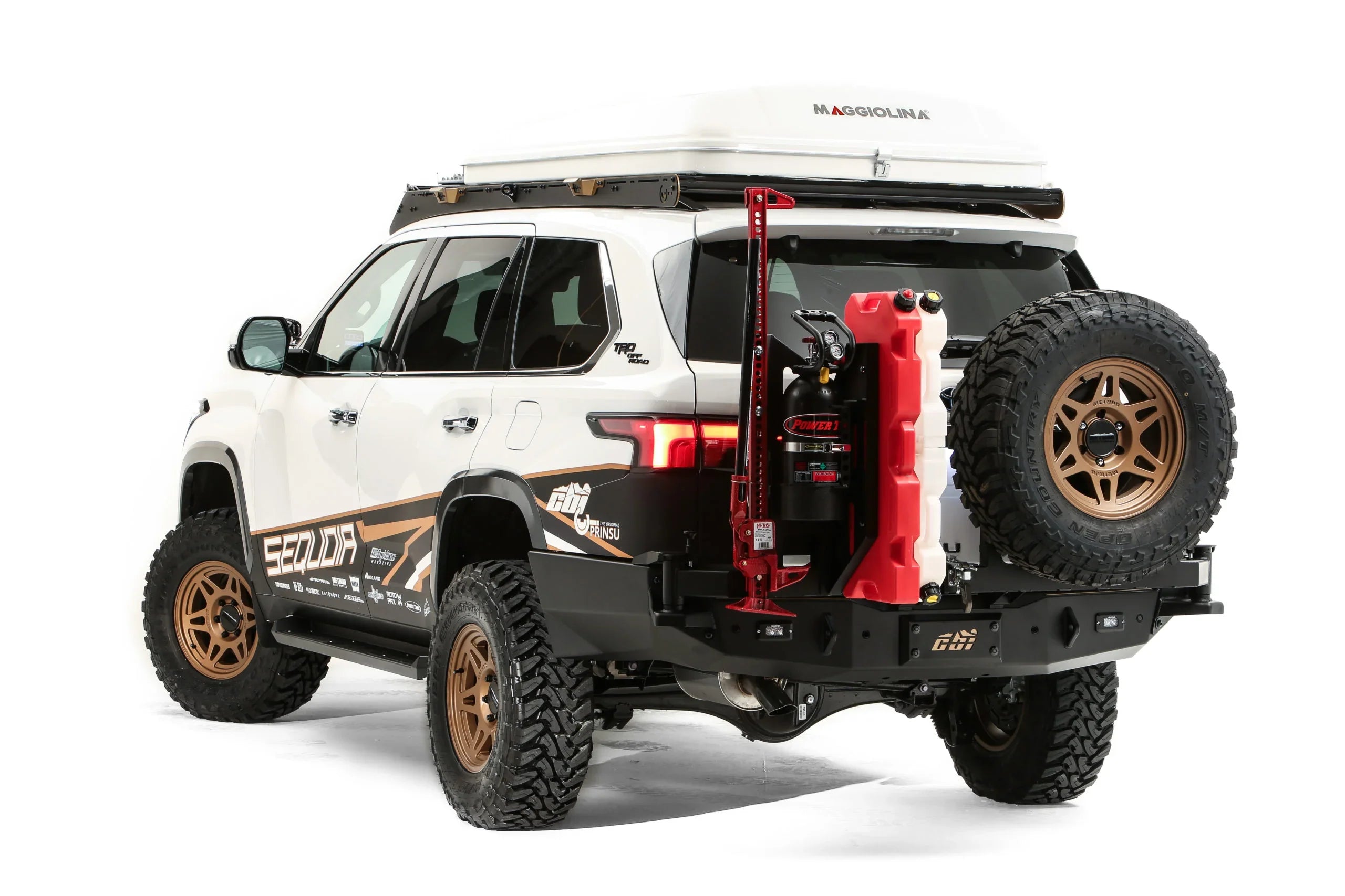 Toyota Sequoia TRD Off-Road SUV with overlanding gear, roof tent, off-road tires, and recovery tools
