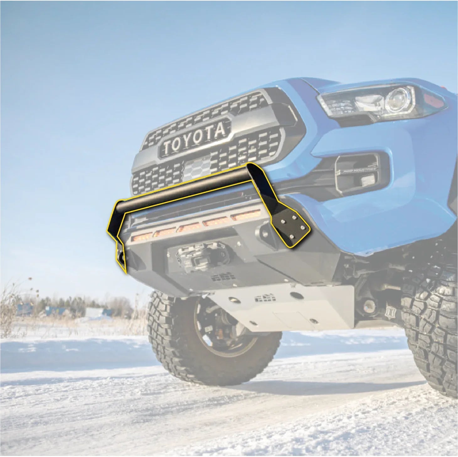 Toyota Tacoma blue truck with bolt-on grill guard in snowy off-road setting