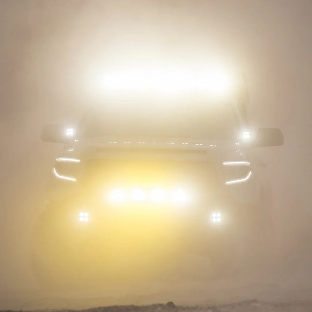 Toyota Tundra with ditch light brackets and LED lights on in heavy fog or dust