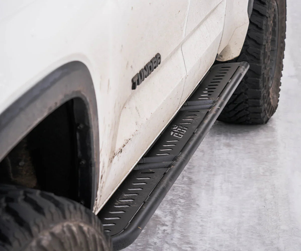 Toyota Tundra overland rock slider on white truck with off-road tires