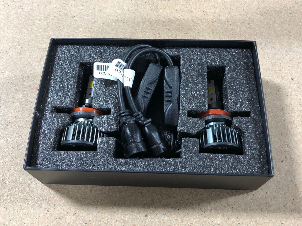 Tri-color LED fog light bulbs kit for Toyota, Jeep, and off-road vehicles in foam packaging