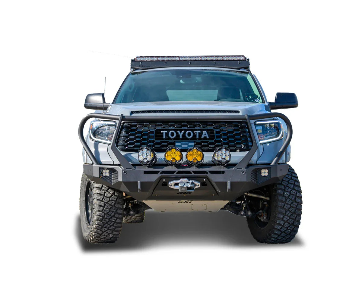 Toyota Tundra with off-road bumper, blackout grille, LED lights, and rugged tires