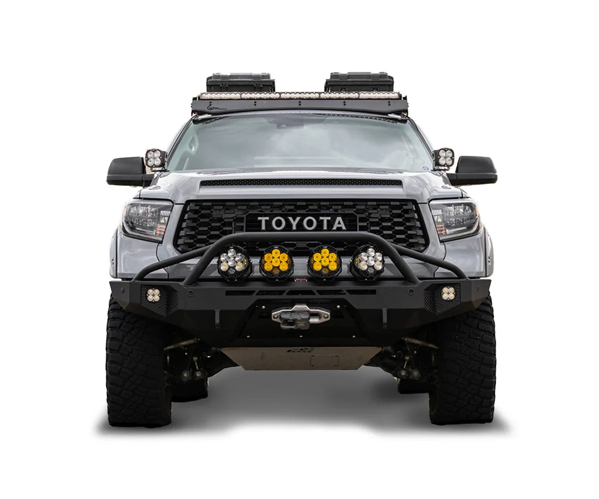 Front view of Toyota Tundra 2018 with off-road bumper, roof racks, and auxiliary lights