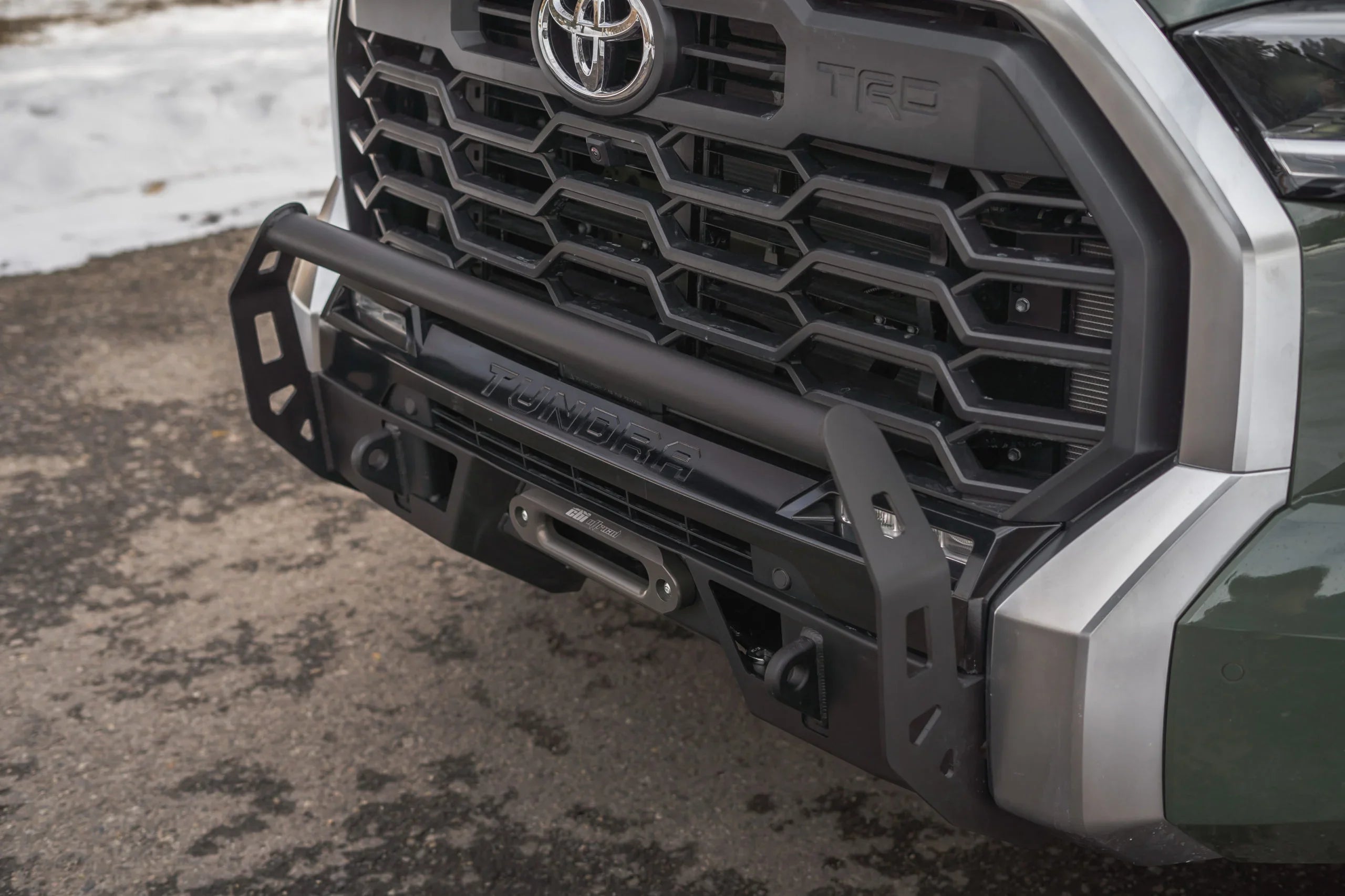 Toyota Tundra TRD front bumper with grille guard and winch mount, off-road vehicle accessory