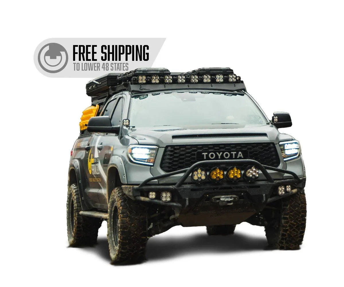 Toyota Tundra overland vehicle with off-road gear, light bars, and free shipping badge