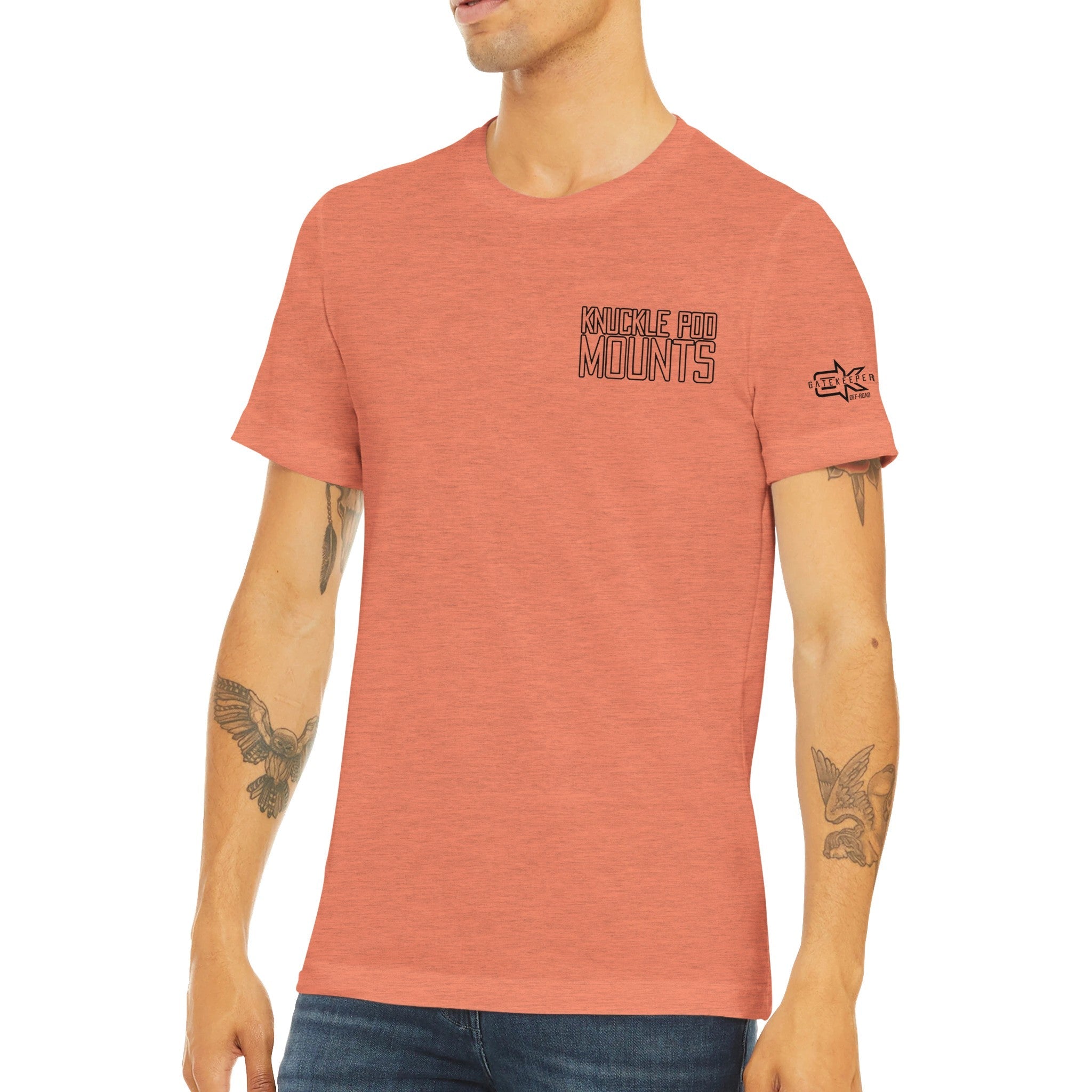 Man wearing a heathered coral Knuckle Pod Mounts t-shirt with sleeve logo, casual style