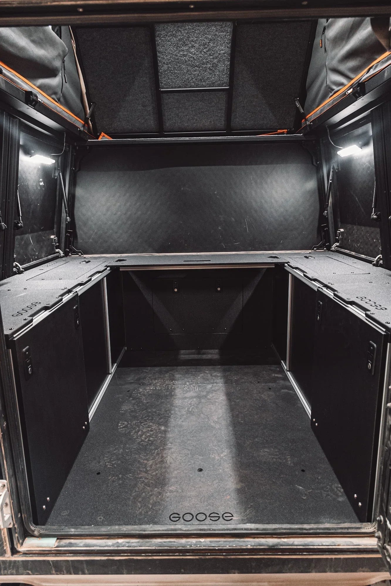 Bed plate storage system inside Alu-Cabin canopy camper for Chevrolet Silverado and GMC Sierra