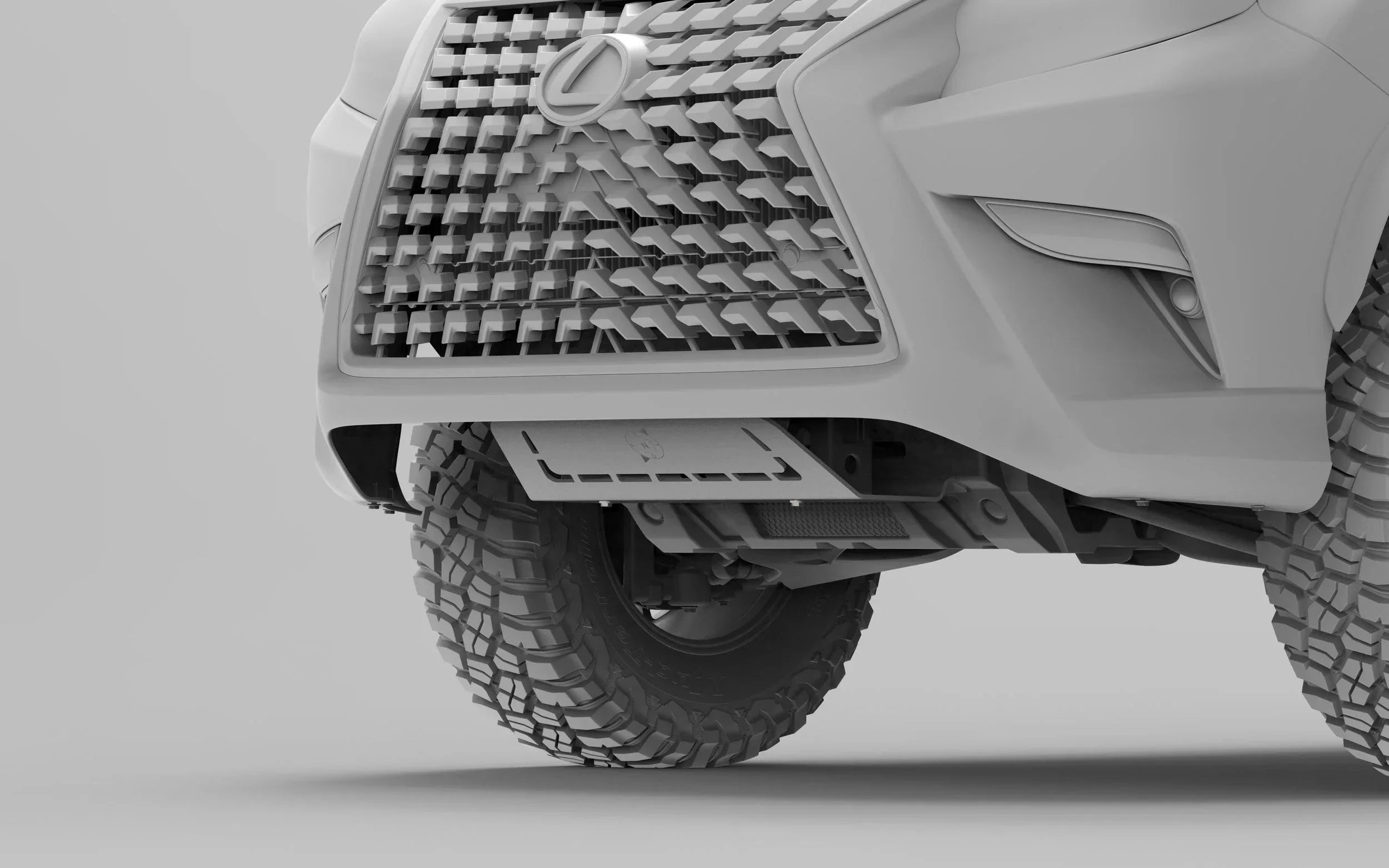 Closeup of off-road skid plate and all-terrain tire on rugged SUV front bumper