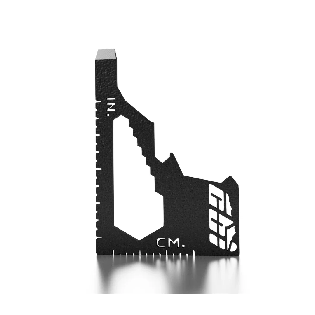 Black metal corner measuring tool with inch and centimeter markings for vehicle outfitting