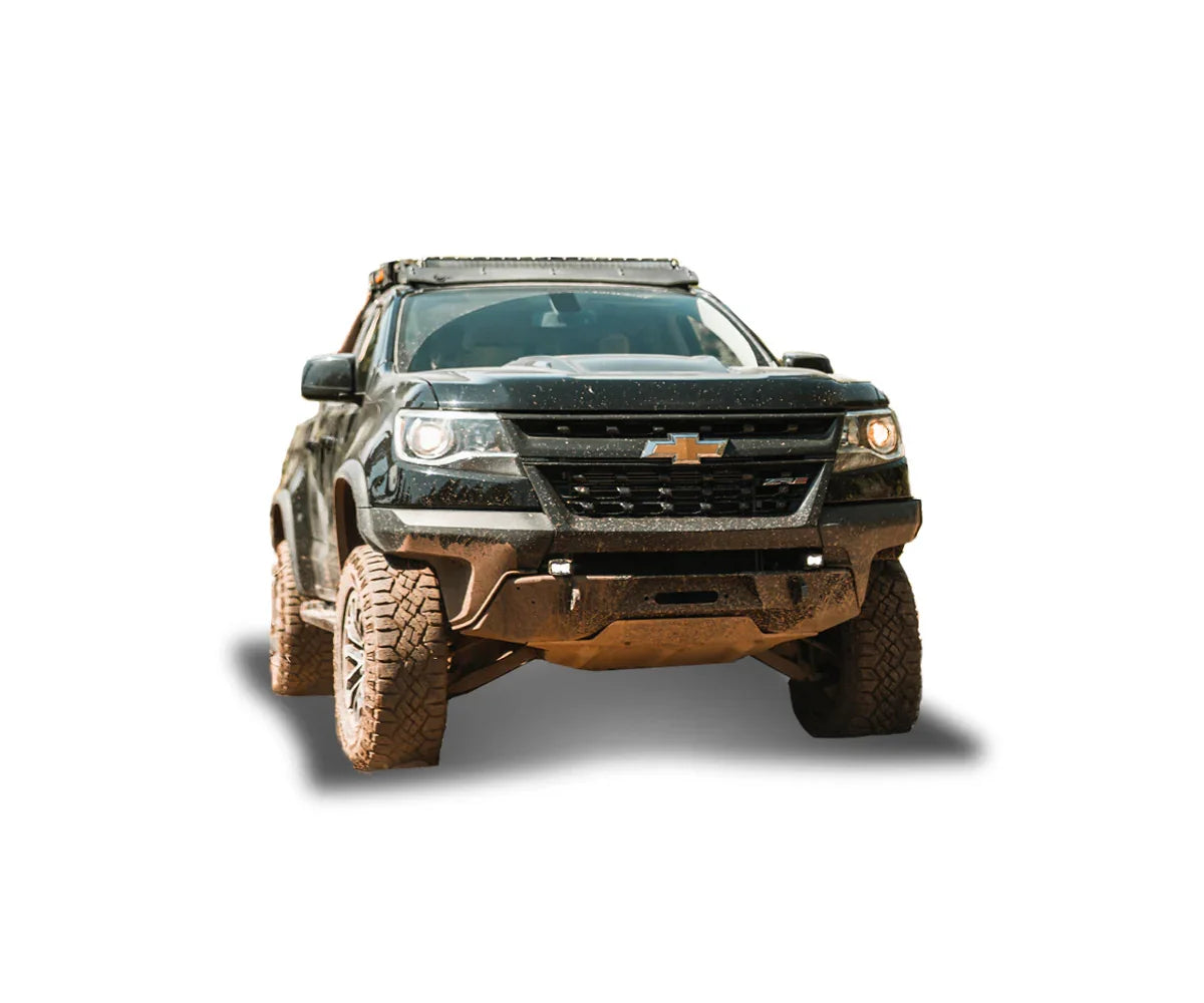 Lifted black Chevrolet Colorado with off-road tires and roof rack, adventure-ready setup