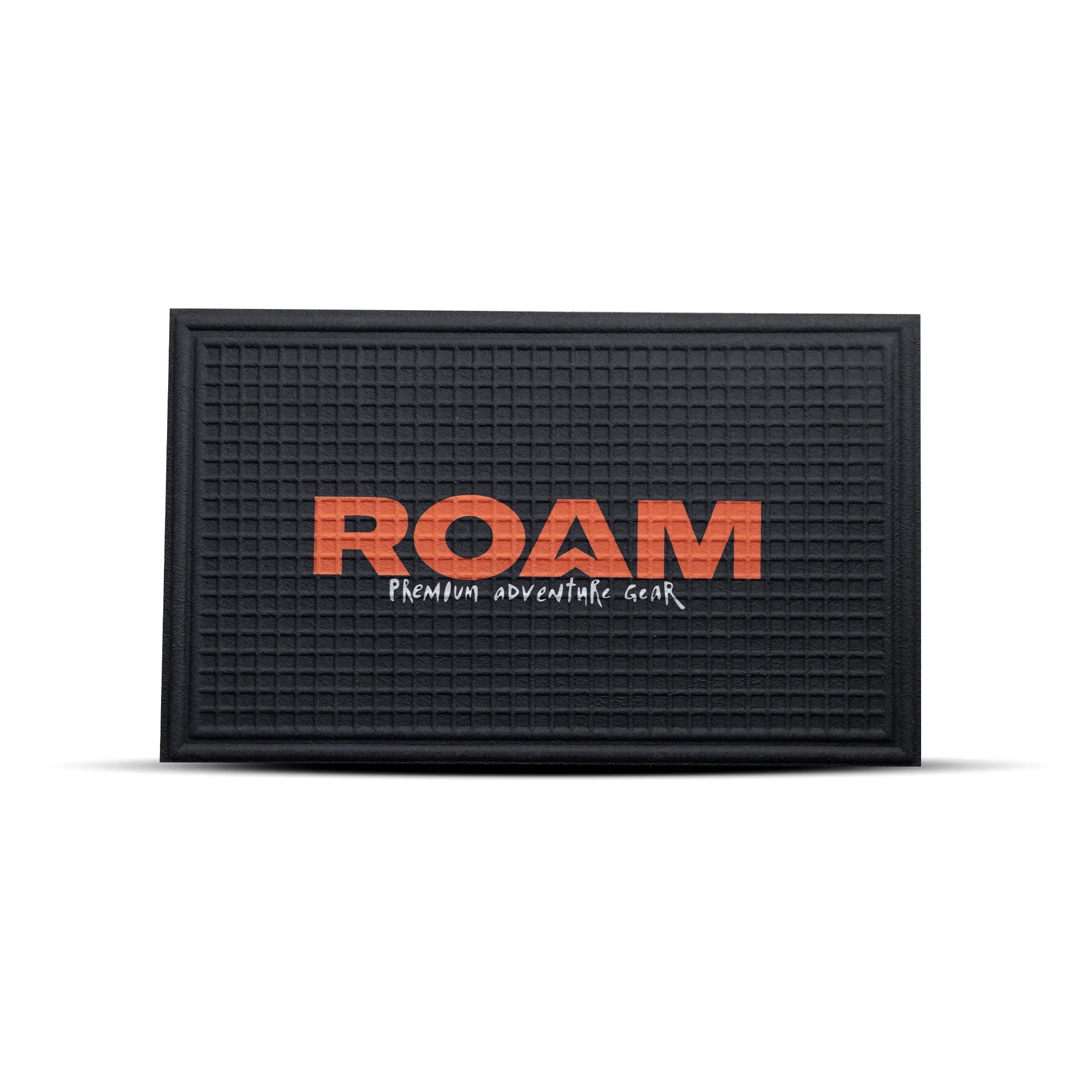Black door mat with textured grid design and orange 'ROAM Premium Adventure Gear' text