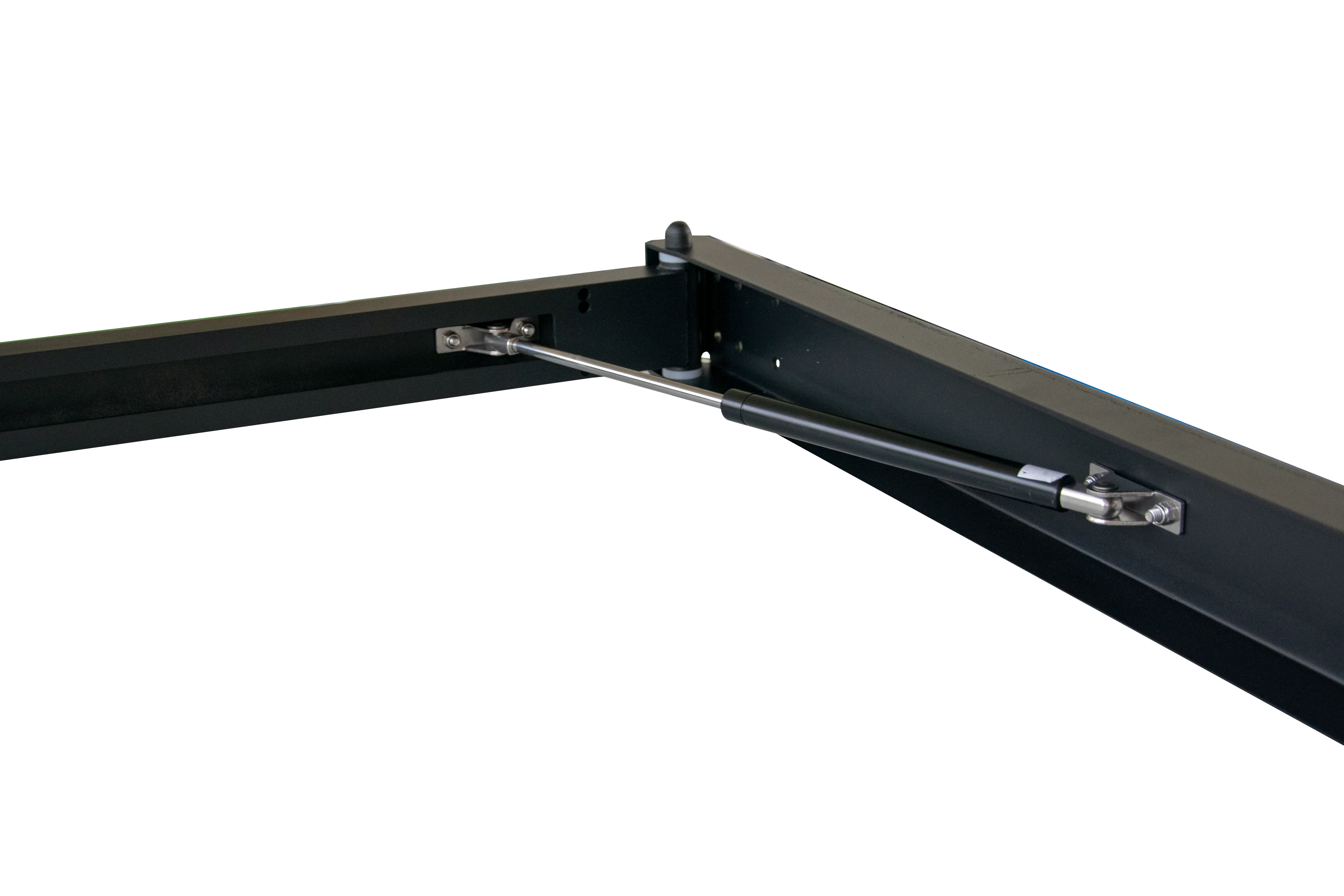 Heavy-duty black gas strut mounted on metal frame, overlanding accessory closeup