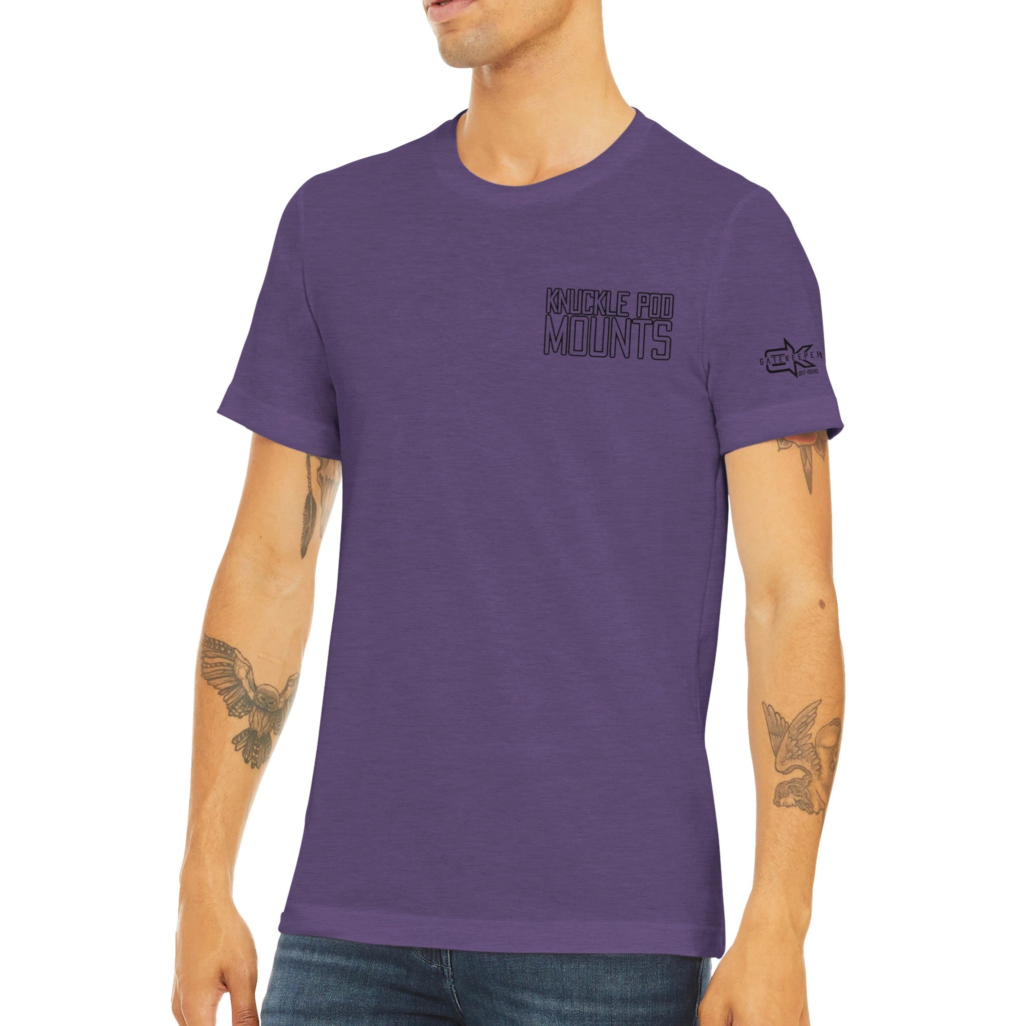 Man wearing purple Knuckle Pod Mounts t-shirt with arm tattoos, casual fit