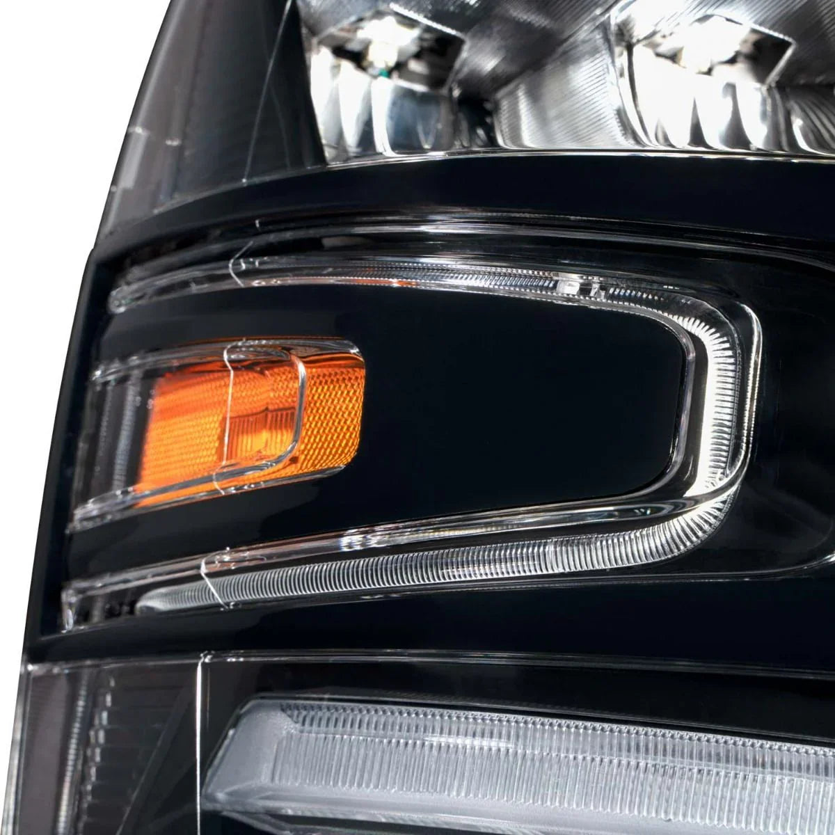 Chevrolet Silverado headlight reflector closeup with clear lens and amber indicator light