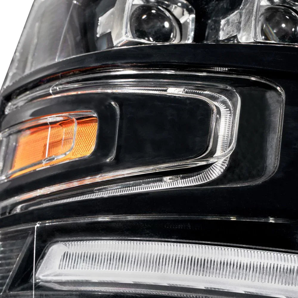 Close-up of Chevy Silverado headlight with amber reflector and LED detailing