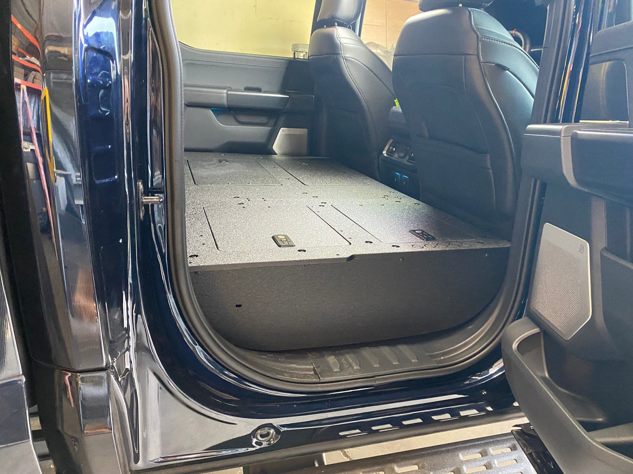 Goose Gear Ford Super Duty Ford - F250-F350 - 2023-Present - 5th Gen. Crew Cab - Second Row Seat Delete Plate System with Factory B&O Subwoofer Center Wall with Exterior Port