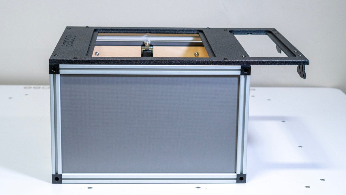Goose Gear front utility module for a 5 ft midsize truck bed seen from the side with the open top and wooden interior