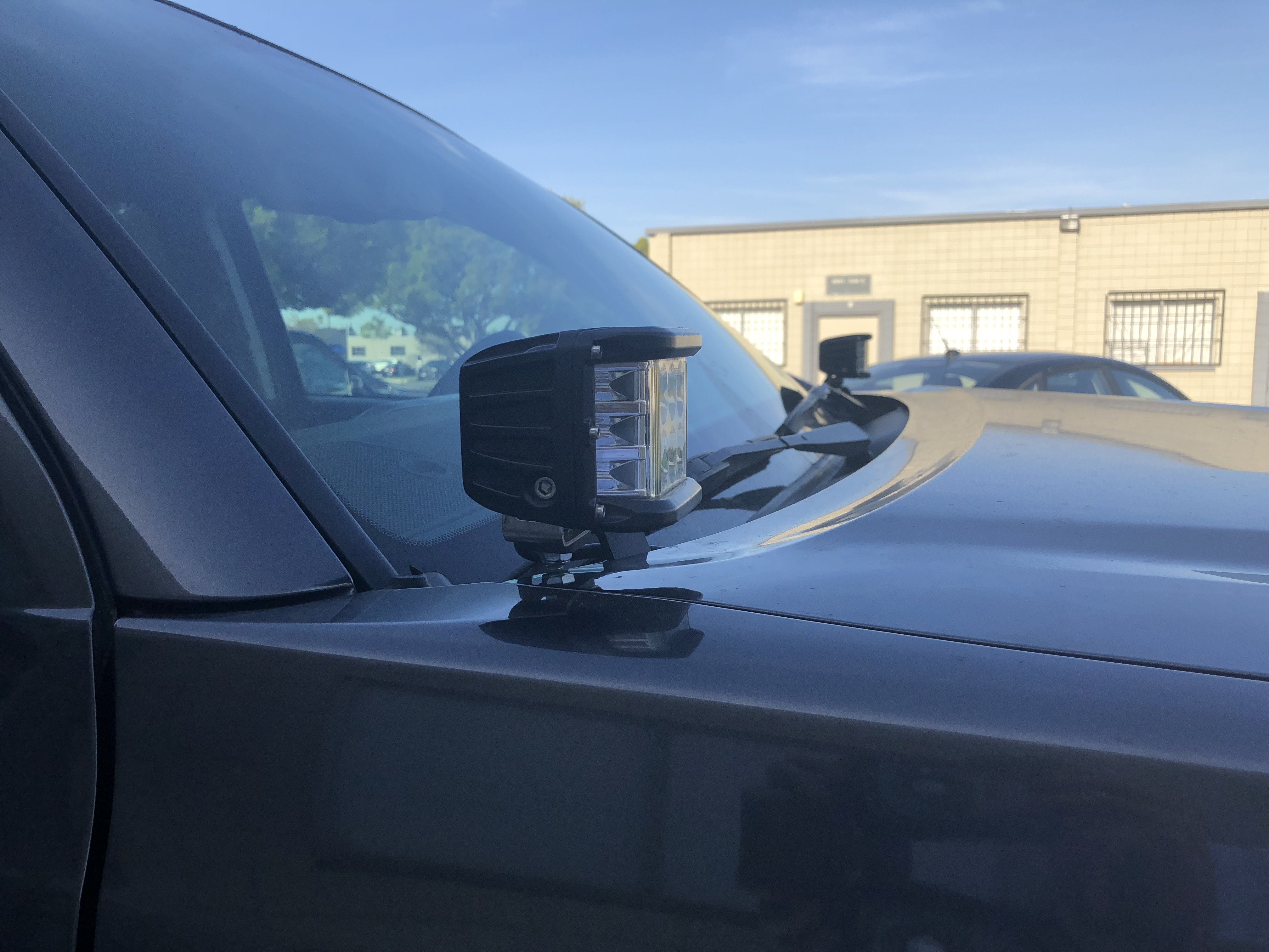 LED off-road pod light mounted on truck hood for overlanding and expedition vehicles