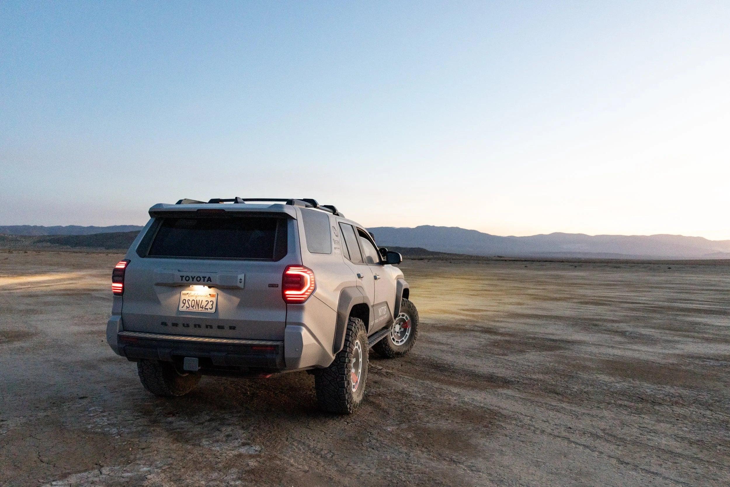 Toyota 4Runner off-road SUV parked on a desert landscape at sunset, equipped for overlanding